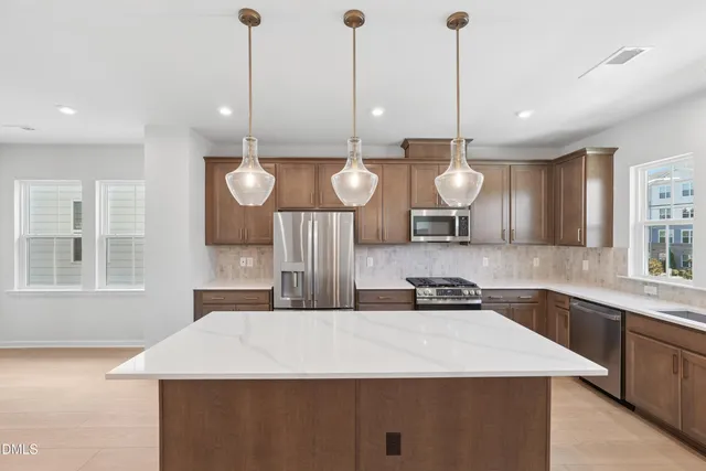 a bathroom with a sink a mirror and a shower
