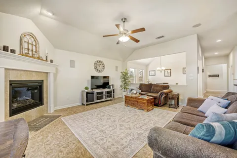 a living room with furniture and a fireplace