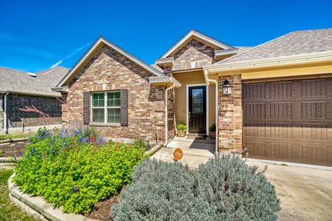 front view of a house with a small yard
