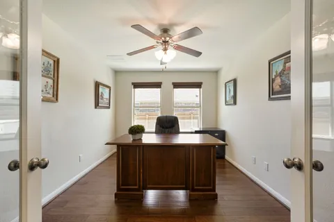 a workspace with furniture and window