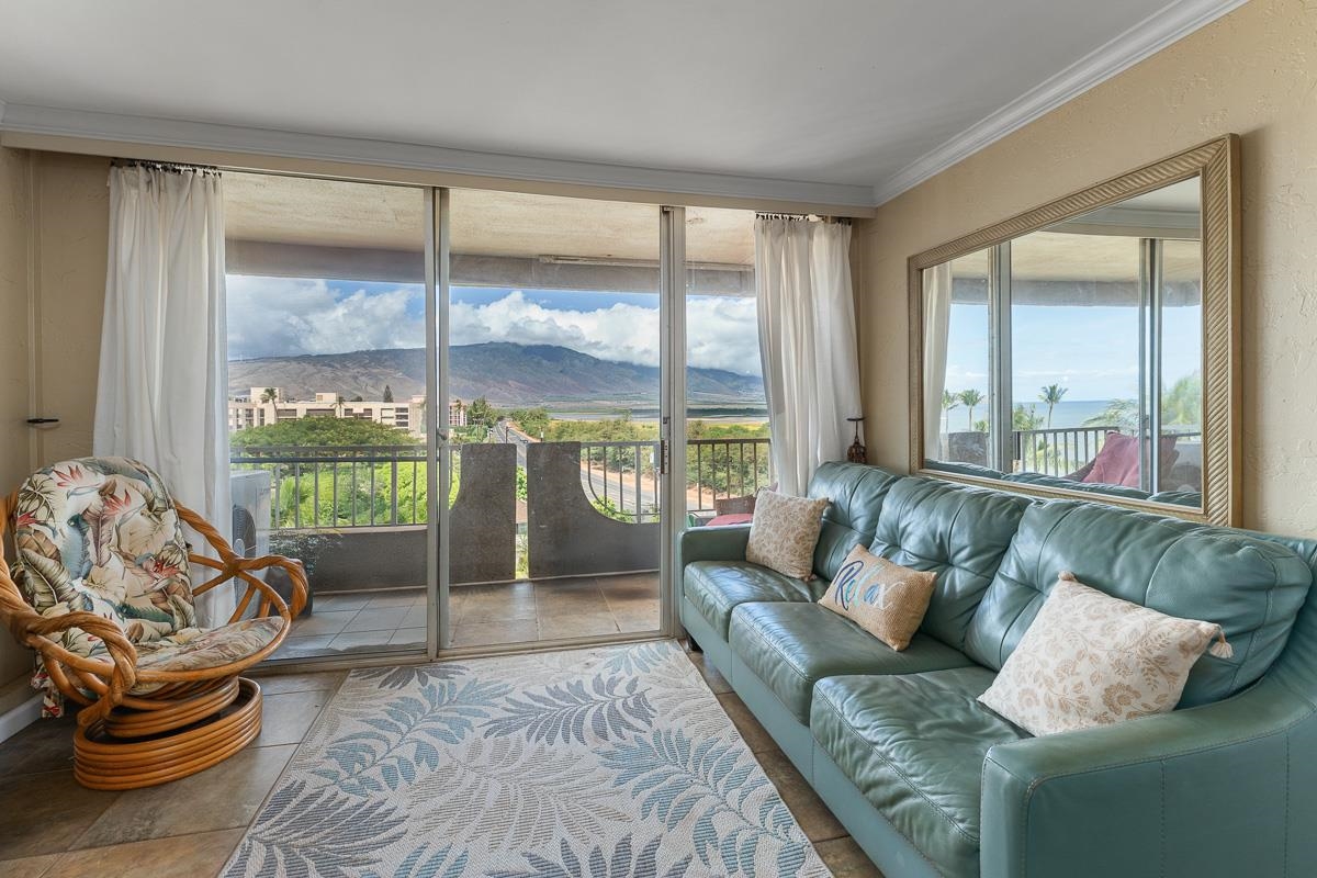 73 North Kihei Road, Unit 602 Kihei, HI 96753 - Photo 17 of 47 a living room with furniture and a large window