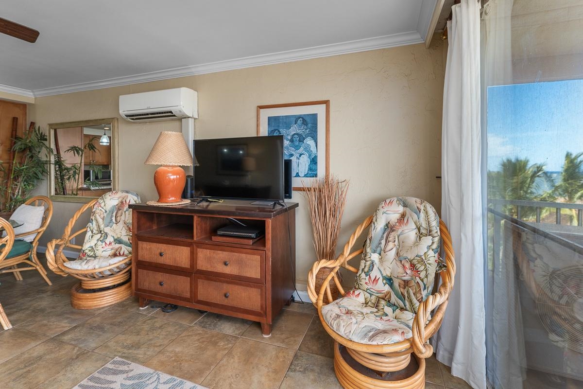 73 North Kihei Road, Unit 602 Kihei, HI 96753 - Photo 18 of 47 a living room with furniture and a flat screen tv
