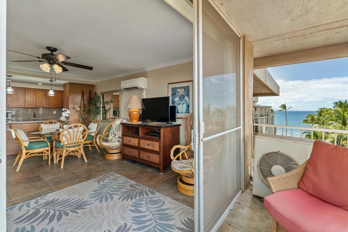 73 North Kihei Road, Unit 602 Kihei, HI 96753 - Photo 22 of 47 a living room with furniture a flat screen tv and kitchen view