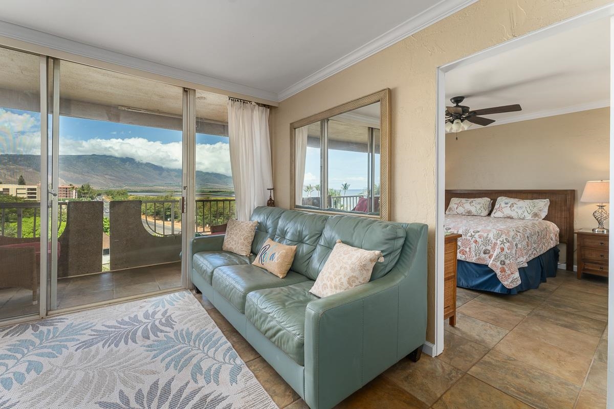 73 North Kihei Road, Unit 602 Kihei, HI 96753 - Photo 24 of 47 a bedroom with furniture and a large window