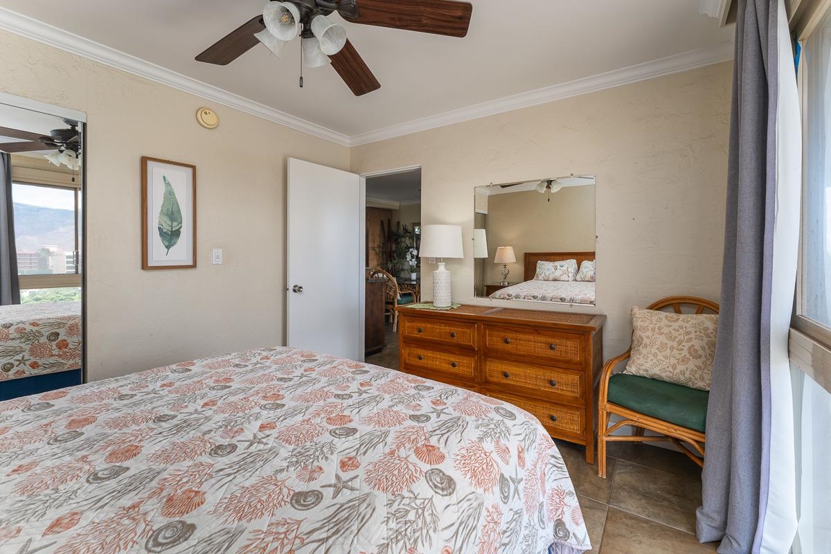 73 North Kihei Road, Unit 602 Kihei, HI 96753 - Photo 28 of 47 a bedroom with a bed and wooden floor