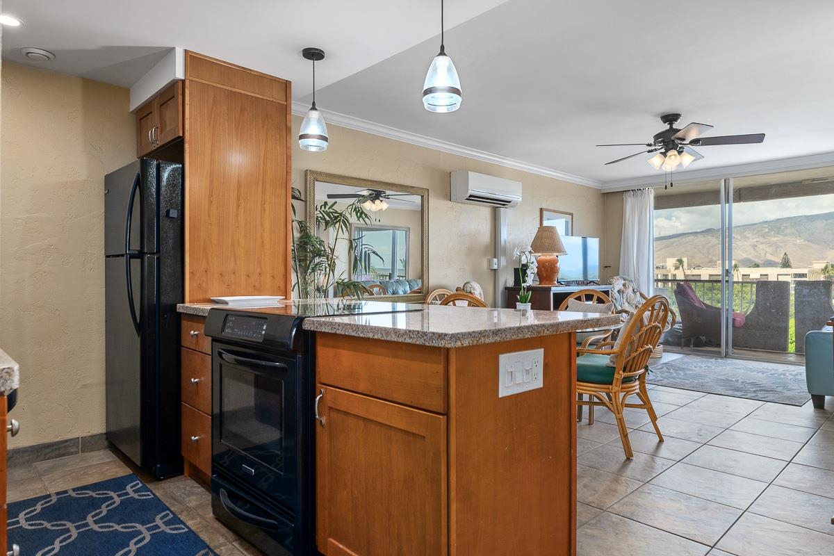 73 North Kihei Road, Unit 602 Kihei, HI 96753 - Photo 3 of 47 a kitchen with stainless steel appliances granite countertop a sink a stove and a refrigerator