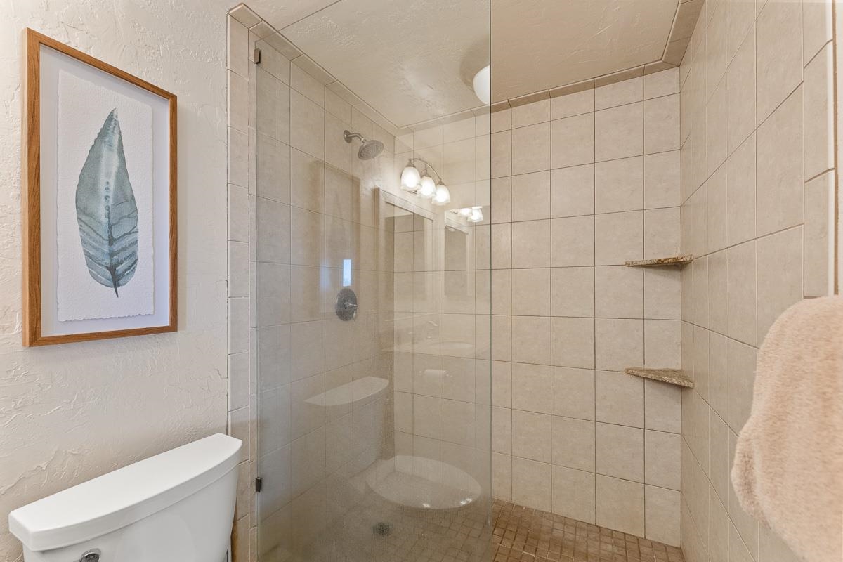 73 North Kihei Road, Unit 602 Kihei, HI 96753 - Photo 32 of 47 a bathroom with a shower and toilet