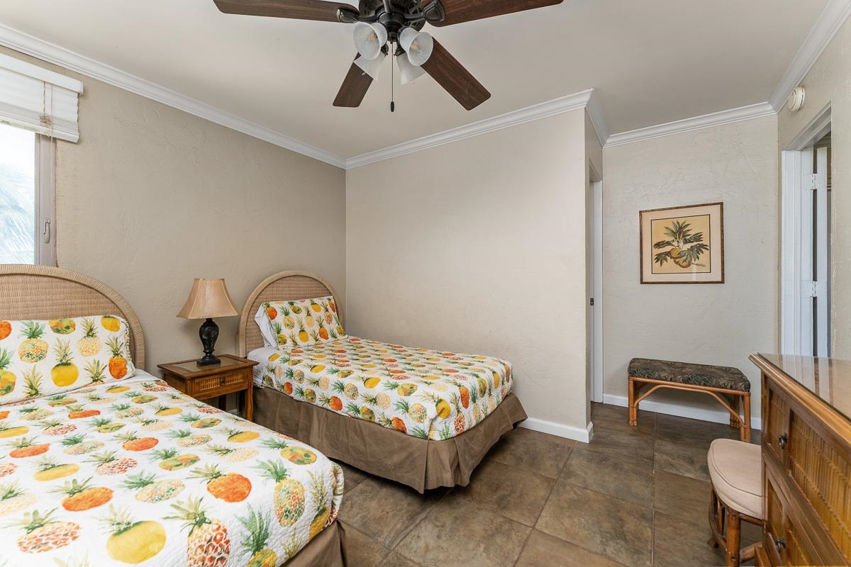 73 North Kihei Road, Unit 602 Kihei, HI 96753 - Photo 35 of 47 a bedroom with two beds and painting on the wall