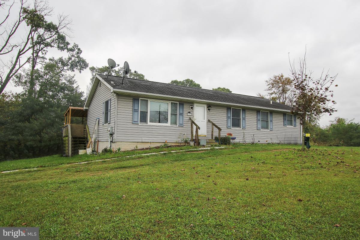 10427 Bessie Clemson Road Union Bridge, MD 21791 - Photo 2 of 8 a front view of house with yard and green space