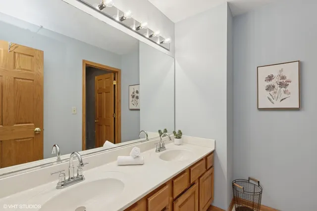 a bedroom with furniture and a wooden floor