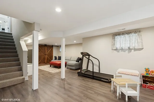 a living room with furniture and a rug