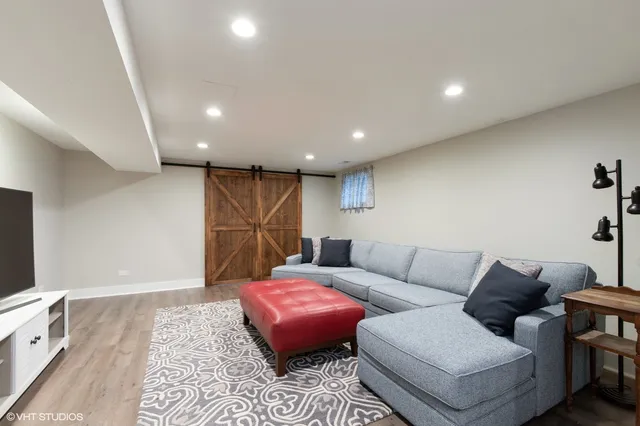 a bathroom with a sink vanity mirror and toilet