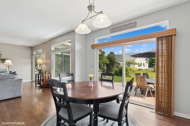 a view of a dining room with furniture window and wooden floor