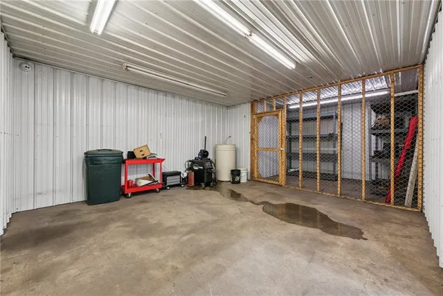 a kitchen with a sink cabinets and window