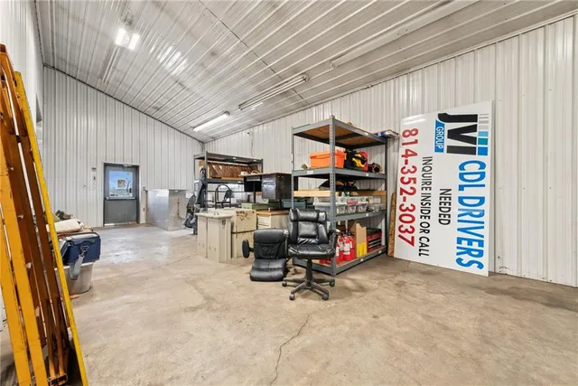 a living room with furniture a dining table and chairs with wooden floor