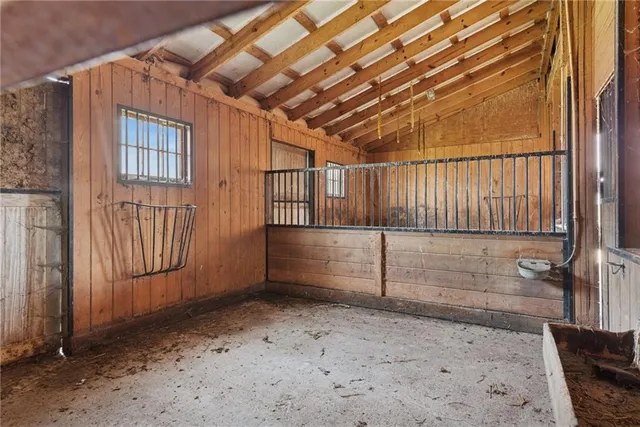 a bathroom with a sink mirror and vanity