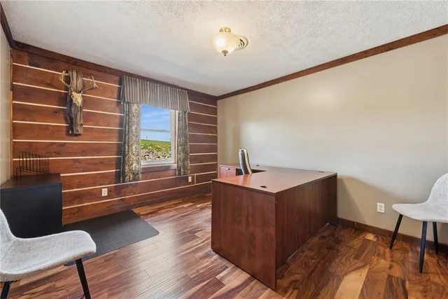 a workspace with furniture and wooden floor