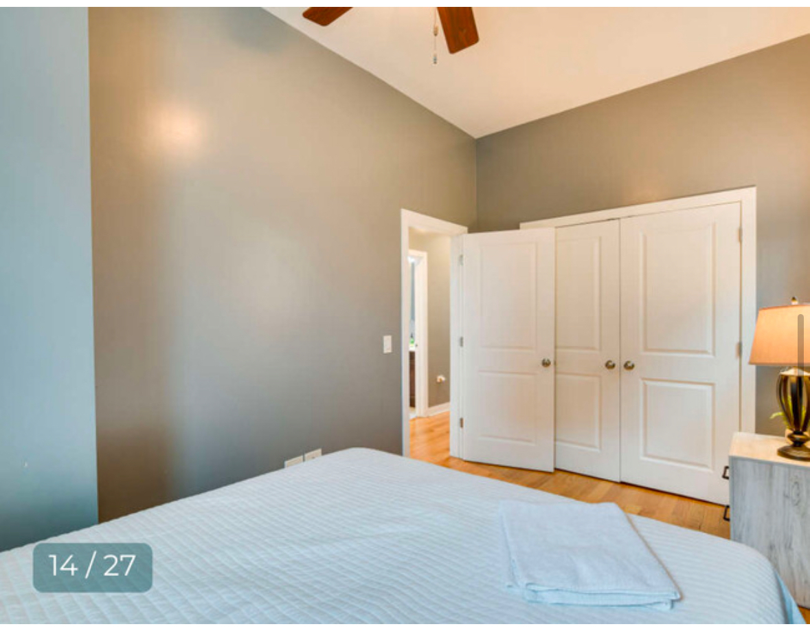 4241 South Langley Avenue, Unit 2 Chicago, IL 60653 - Photo 7 of 11 a bedroom with a bed and a window