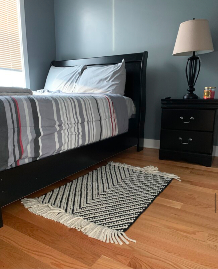 4241 South Langley Avenue, Unit 2 Chicago, IL 60653 - Photo 9 of 11 a bedroom with a bed and a window