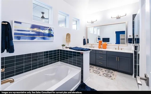 a bathroom with a bathtub sink and mirror