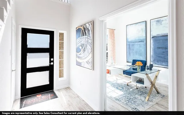 a view of living room filled with furniture and window