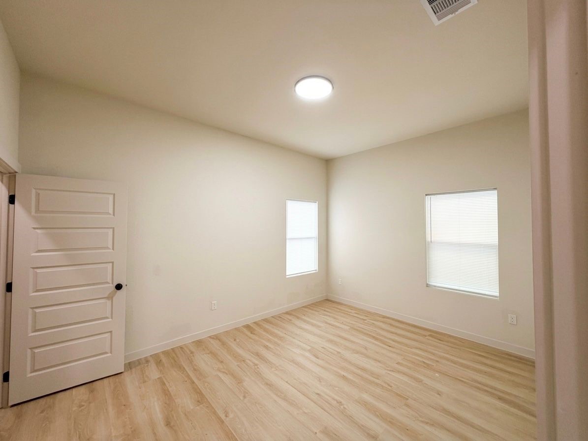 9736 Garcroft Street Houston, TX 77029 - Photo 11 of 17 wooden floor in an empty room