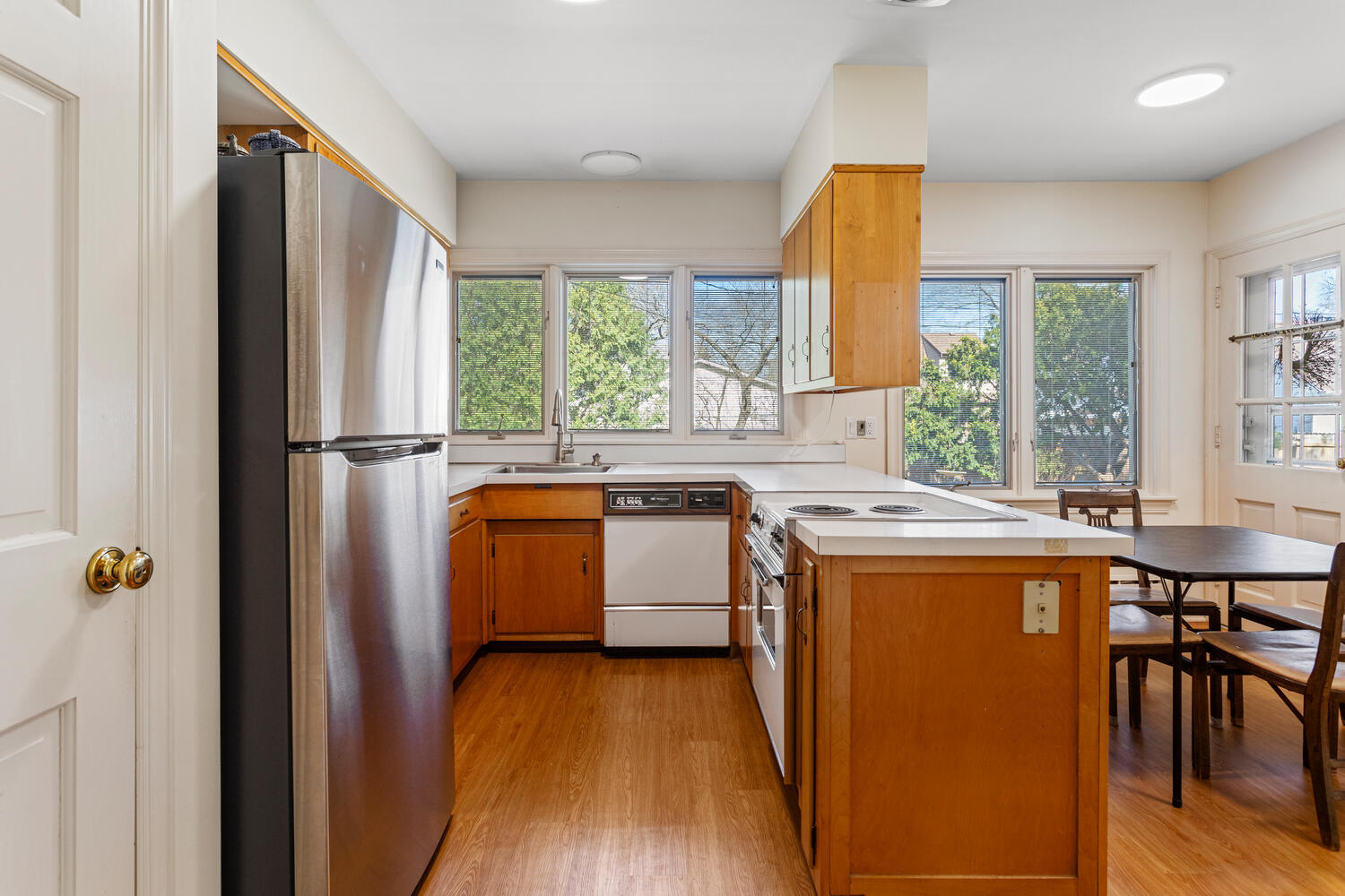 1120 West Charles Street Champaign, IL 61821 - Photo 11 of 36 a view of a kitchen with a window and wooden floor