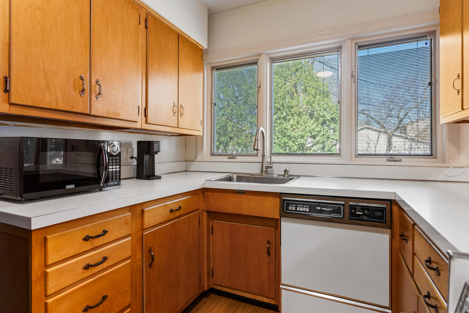 1120 West Charles Street Champaign, IL 61821 - Photo 13 of 36 a kitchen with stainless steel appliances granite countertop a sink and a microwave