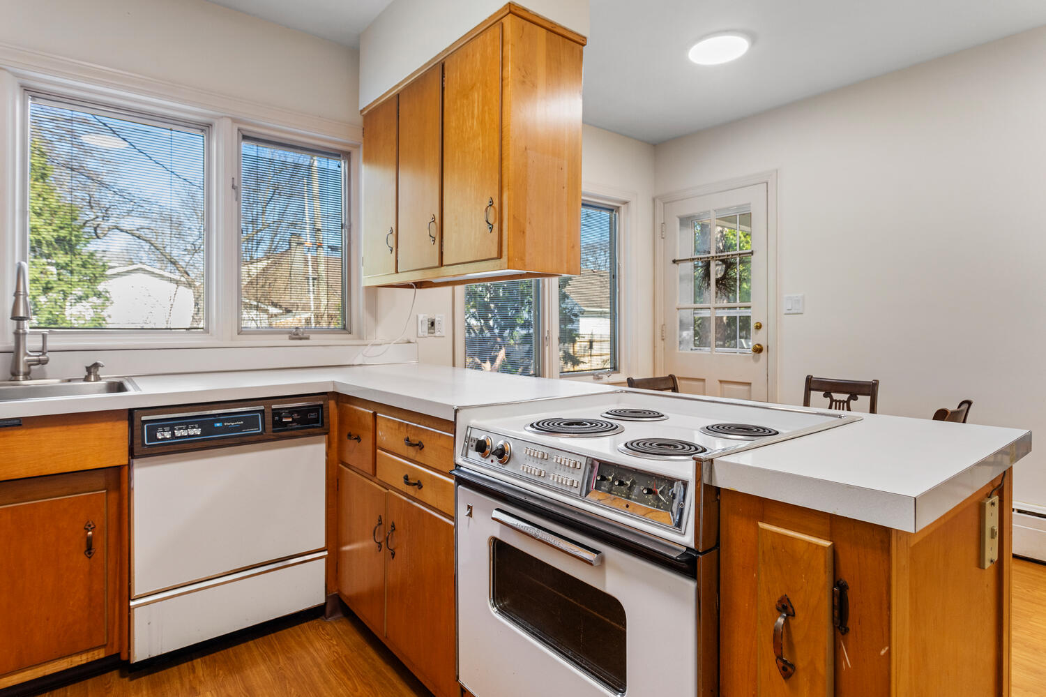 1120 West Charles Street Champaign, IL 61821 - Photo 14 of 36 a kitchen with a stove a sink and a microwave