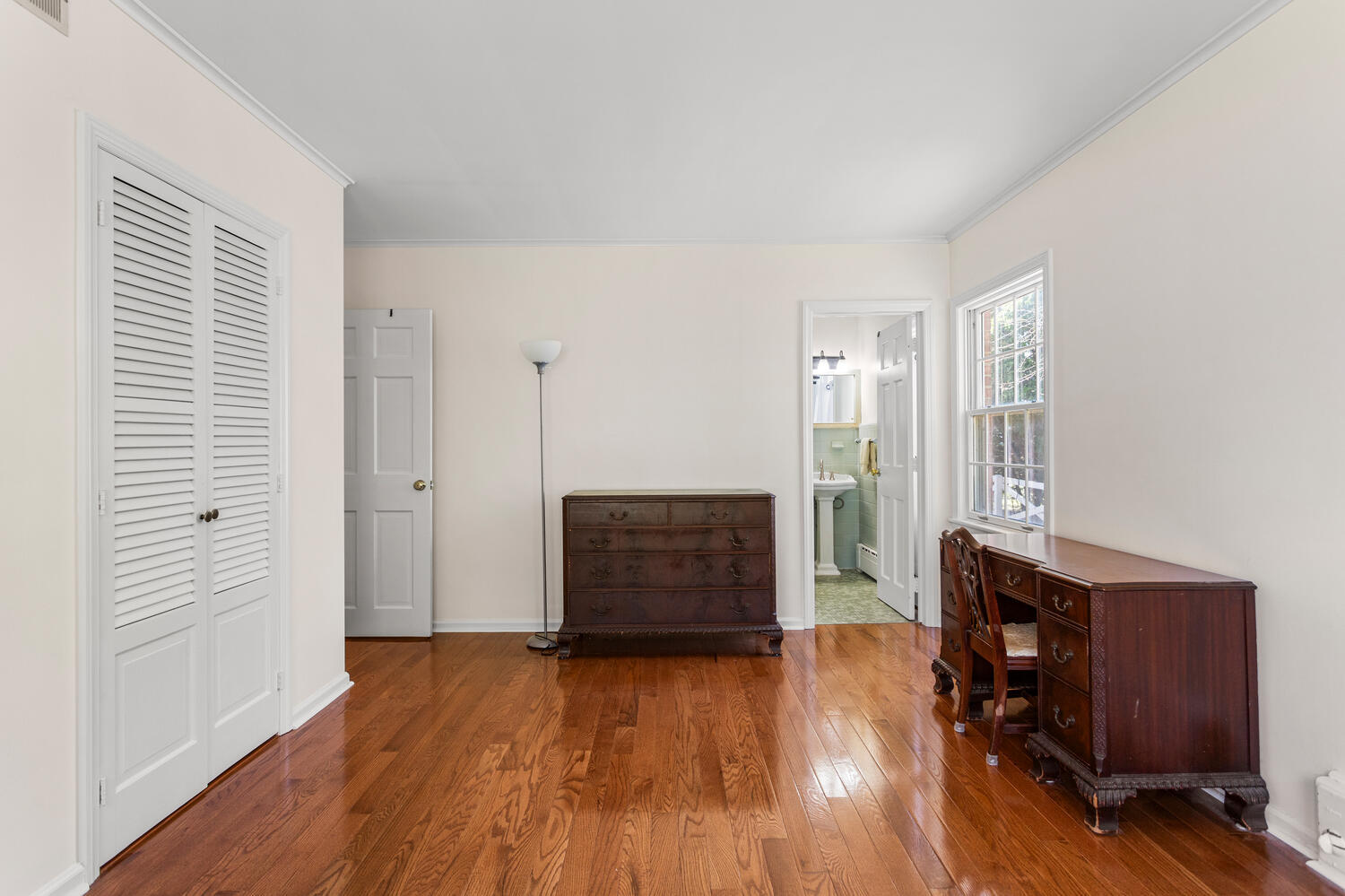 1120 West Charles Street Champaign, IL 61821 - Photo 19 of 36 an empty room with wooden floor and windows