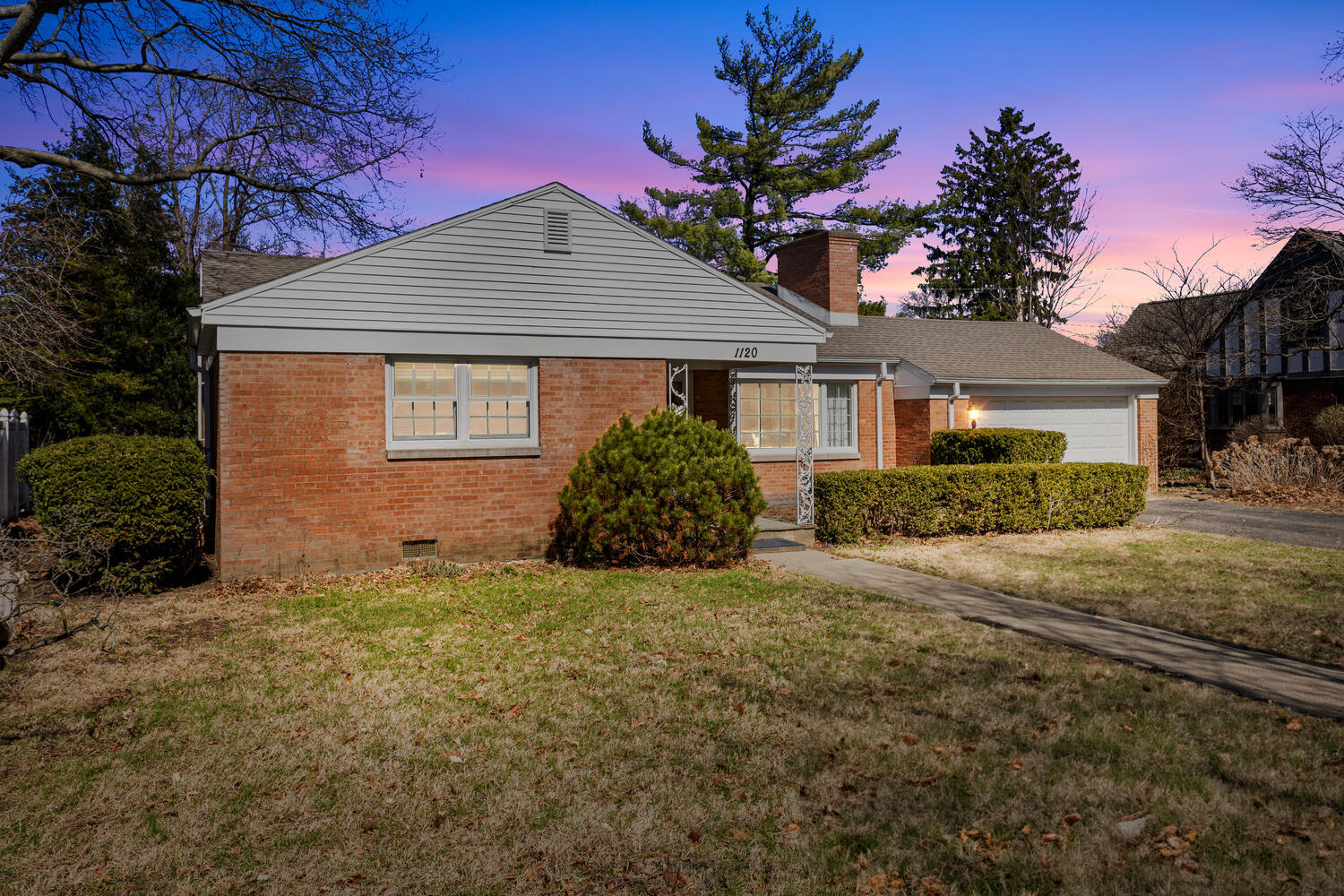 1120 West Charles Street Champaign, IL 61821 - Photo 2 of 36 a house with a tree in front of it