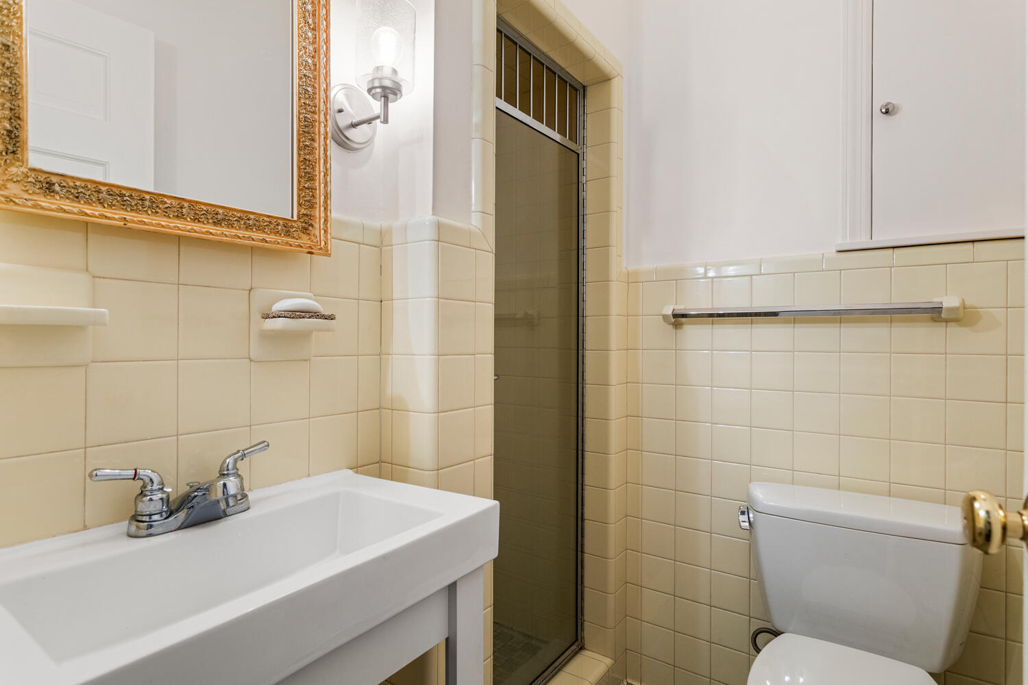 1120 West Charles Street Champaign, IL 61821 - Photo 23 of 36 a bathroom with a sink a toilet and shower