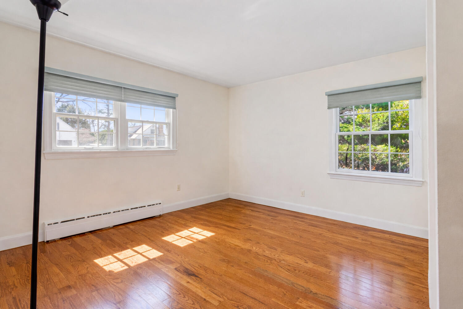 1120 West Charles Street Champaign, IL 61821 - Photo 24 of 36 an empty room with wooden floor and windows