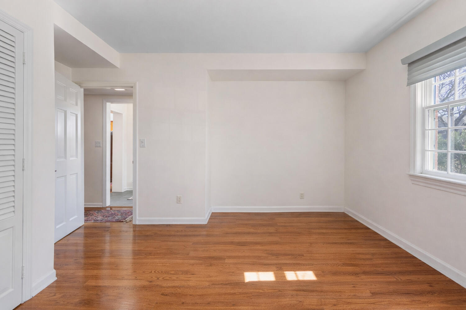 1120 West Charles Street Champaign, IL 61821 - Photo 25 of 36 a view of a room with wooden floor and window
