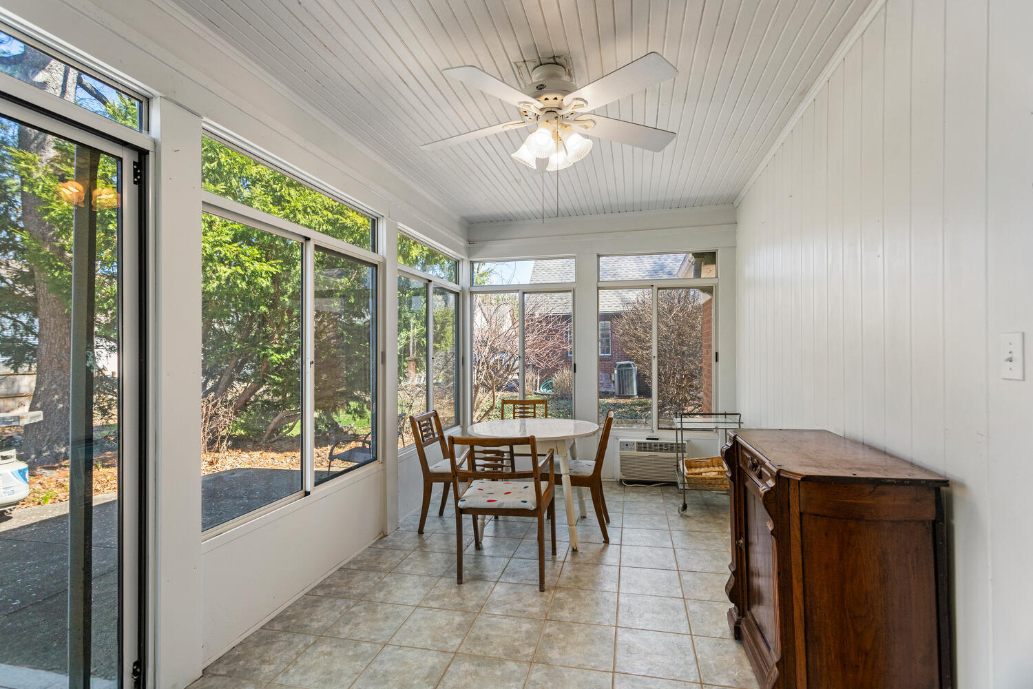 1120 West Charles Street Champaign, IL 61821 - Photo 26 of 36 a view of a dining room with furniture large windows and wooden floor