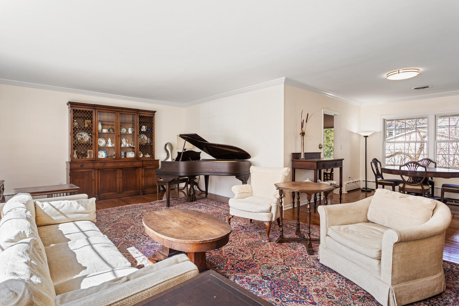 1120 West Charles Street Champaign, IL 61821 - Photo 7 of 36 a living room with furniture a table and kitchen view