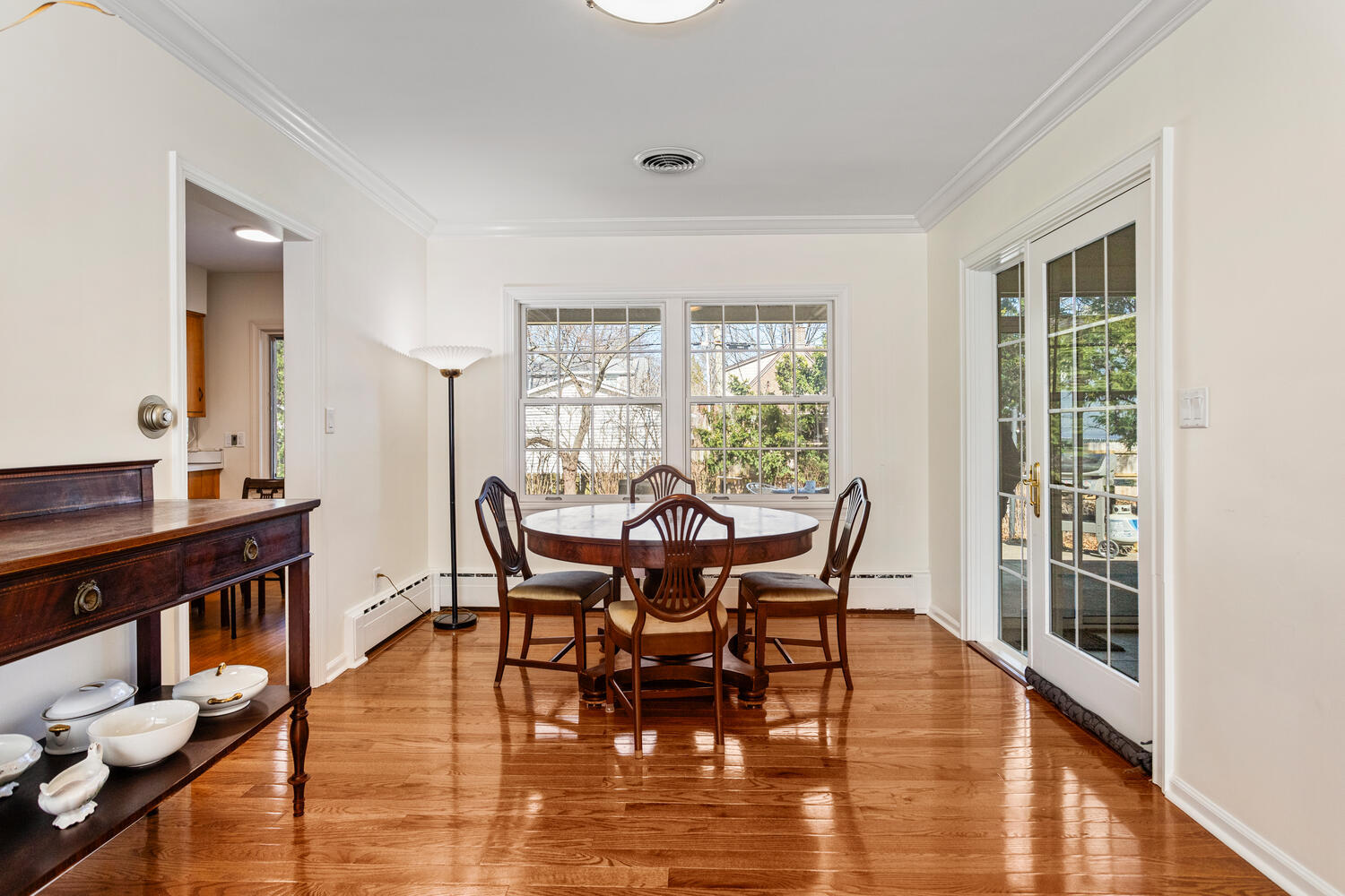 1120 West Charles Street Champaign, IL 61821 - Photo 9 of 36 a view of a dining room with furniture window and wooden floor