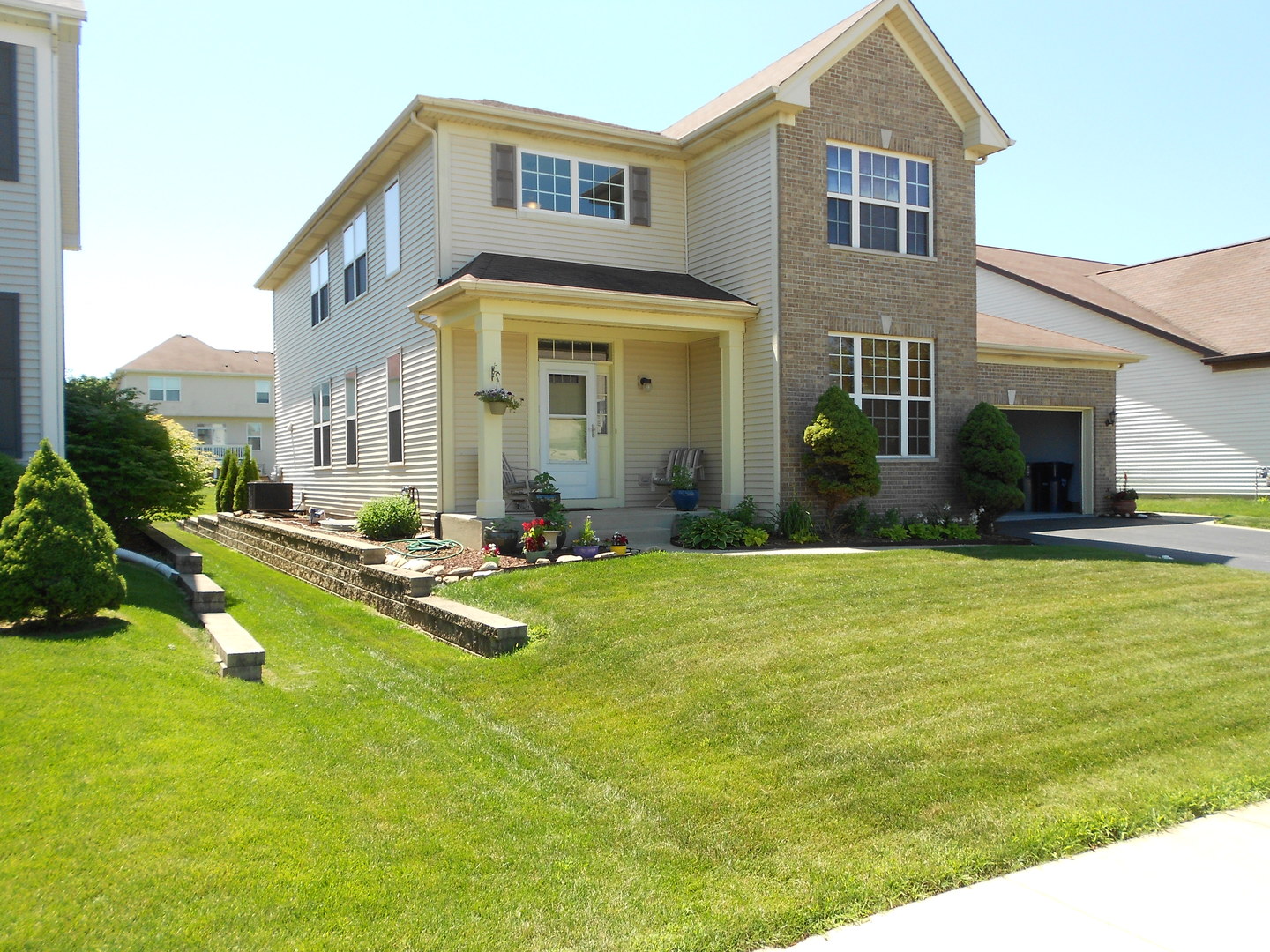 1721 Pin Oak Lane Elgin, IL 60120 - Photo 1 of 39 a view of a house with a swimming pool