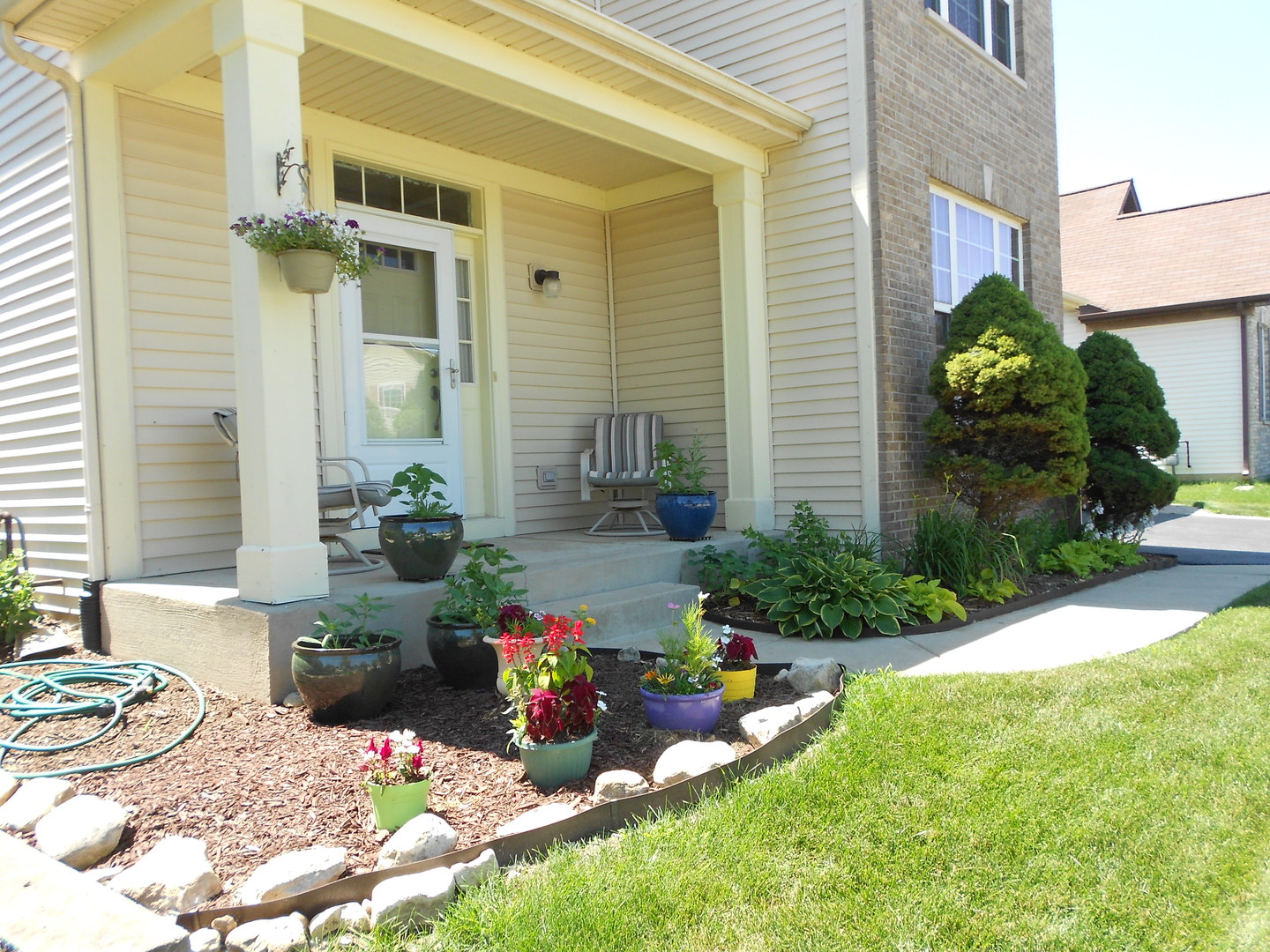 1721 Pin Oak Lane Elgin, IL 60120 - Photo 2 of 39 a view of a chair and table in backyard of the house