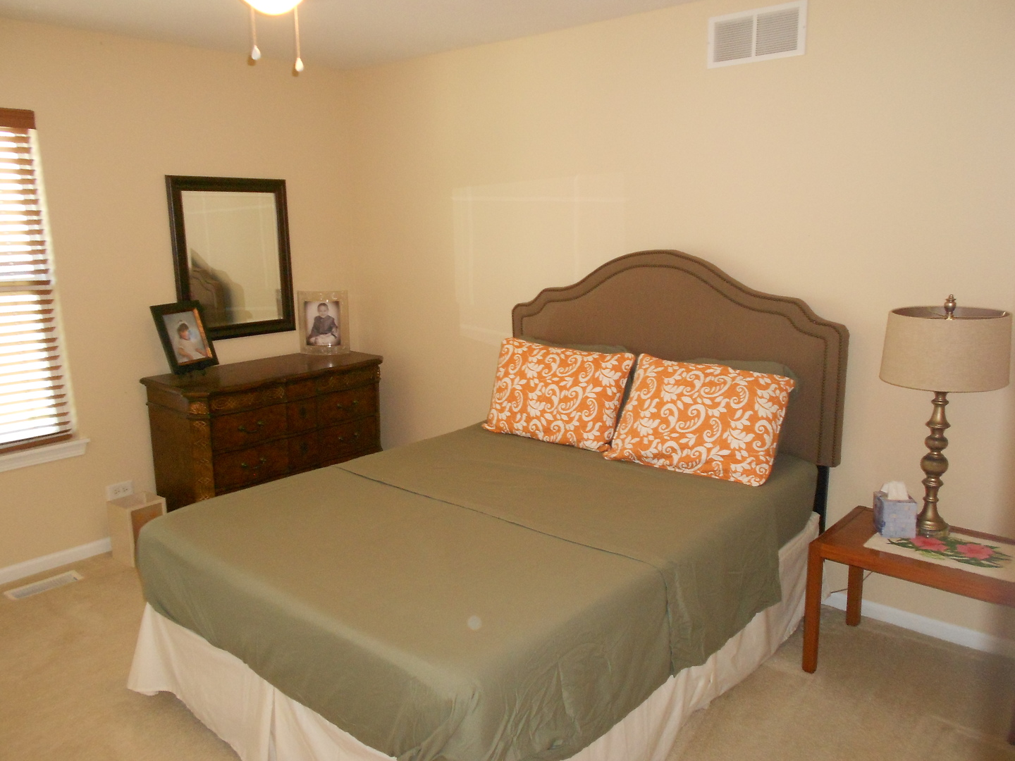 1721 Pin Oak Lane Elgin, IL 60120 - Photo 27 of 39 a bedroom with a bed and a lamp on table