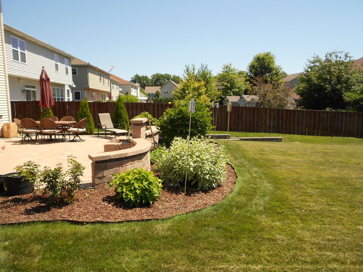 1721 Pin Oak Lane Elgin, IL 60120 - Photo 6 of 39 a swimming pool with outdoor seating and yard