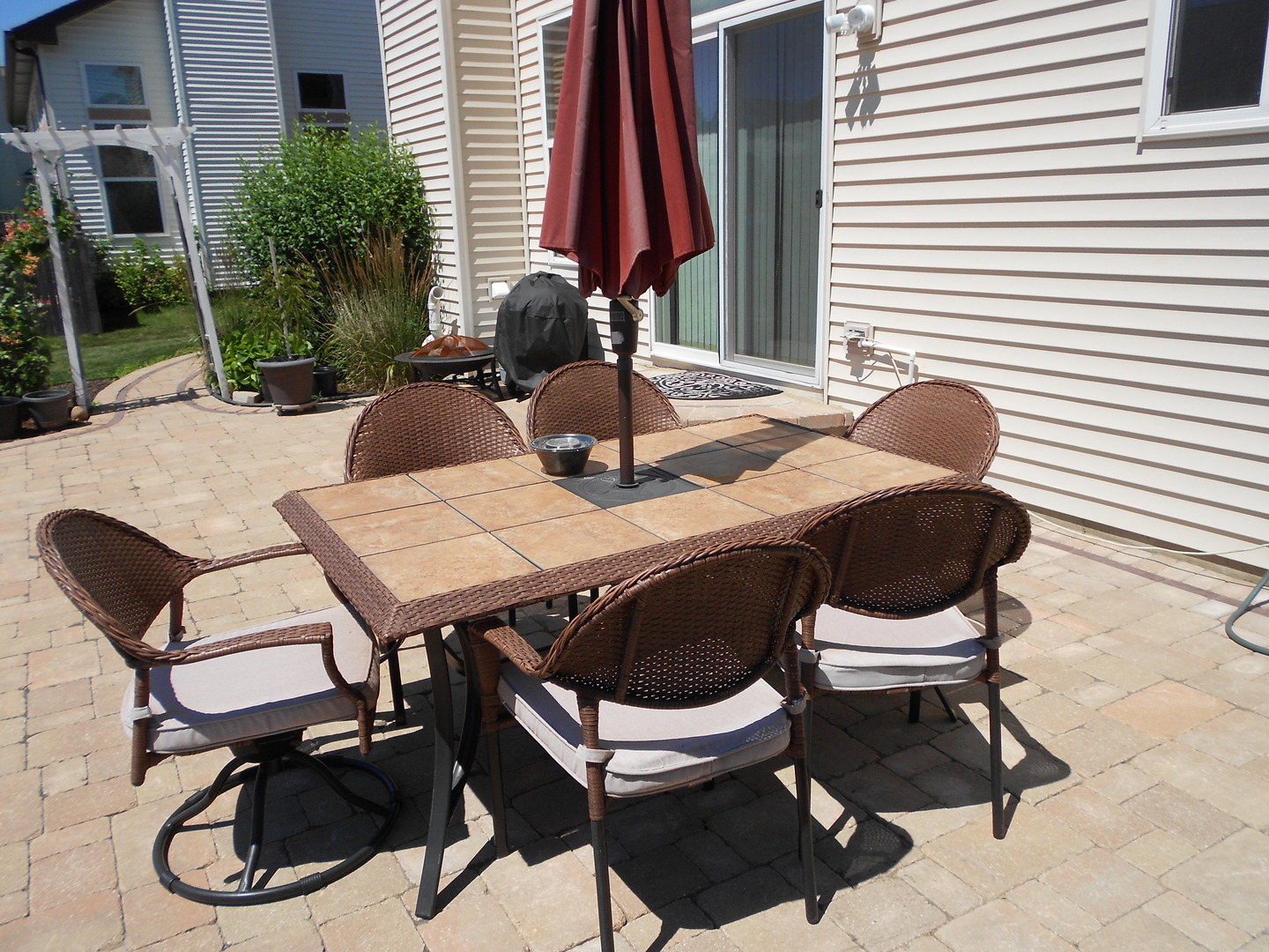 1721 Pin Oak Lane Elgin, IL 60120 - Photo 8 of 39 a outdoor dining space with furniture and a potted plant