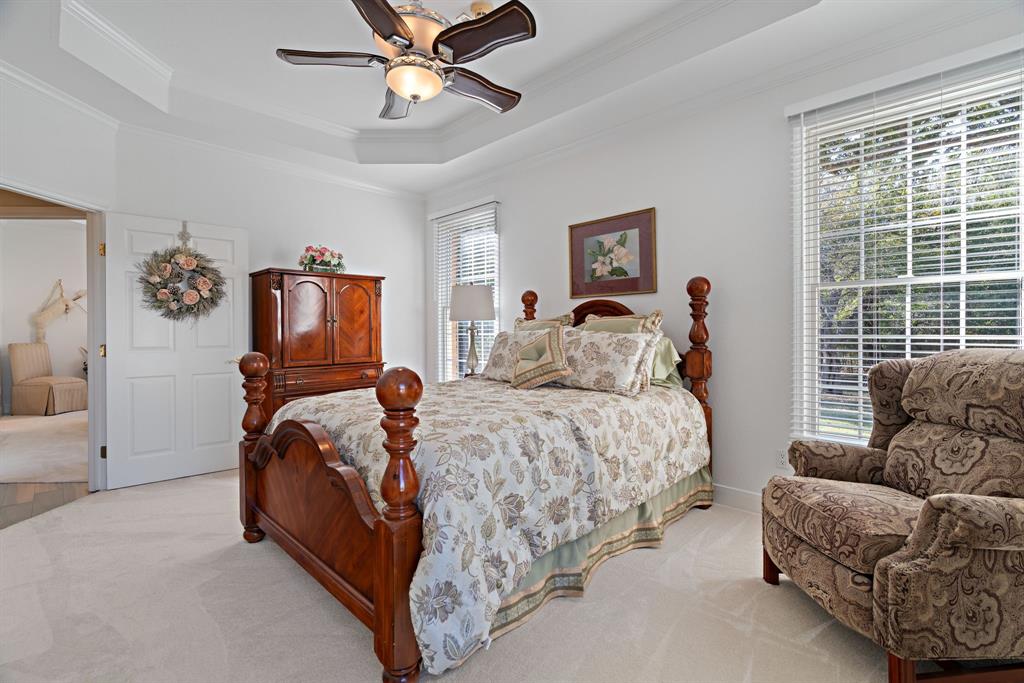 72 Crown Road Willow Park, TX 76087 - Photo 17 of 40 a bedroom with a bed couch and window