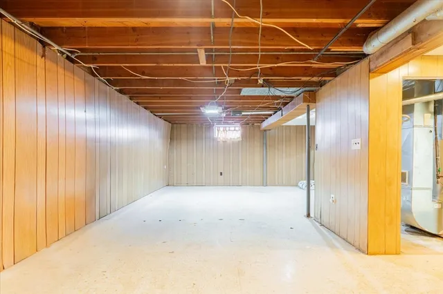 a view of a room with wooden walls