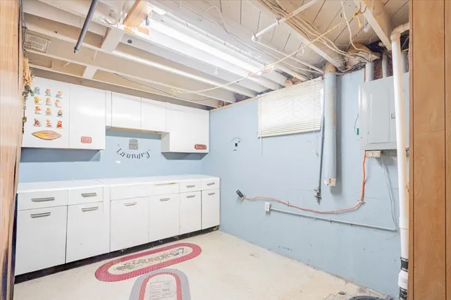 a utility room with cabinets