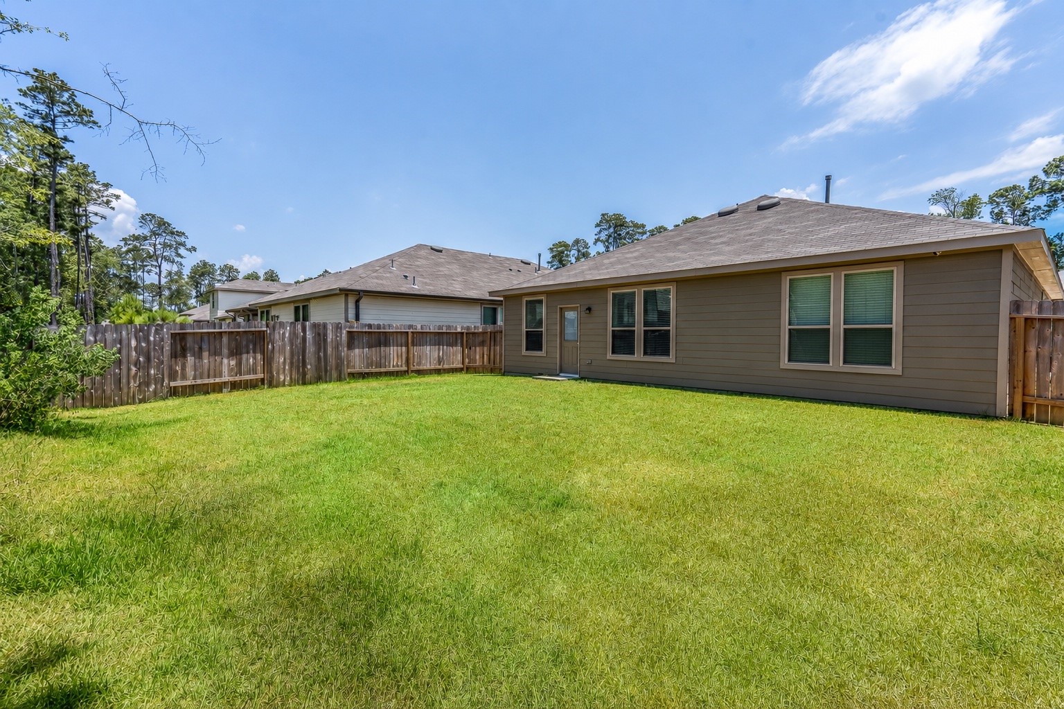 4256 Pine Still Road Conroe, TX 77304 - Photo 19 of 21 Immense backyard great for entertaining or relaxing