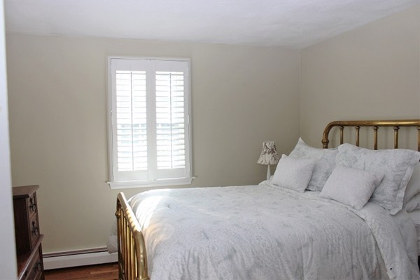 9 Shadwell Road Scituate, MA 02066 - Photo 15 of 24 a bedroom with a bed and a window