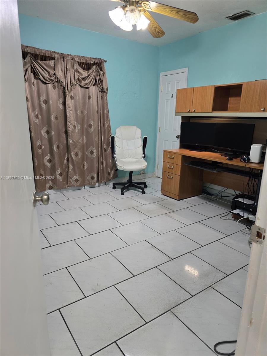 102 West 27th Street Hialeah, FL 33010 - Photo 11 of 26 a living room with a rug