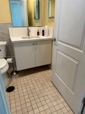 a bathroom with a toilet and a sink