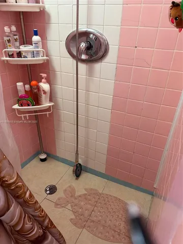 a dining room with furniture and chandelier
